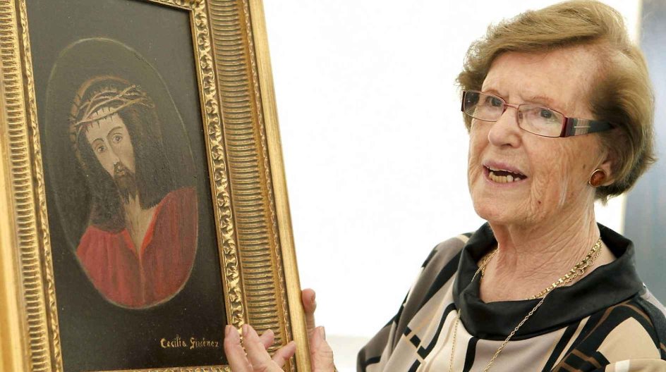 epa03798309 Cecilia Gimenez, the elderly woman who 'restored' the 19th century Ecce Homo mural painting at a church in northern Spain in 2012, poses next to her painting which is to be used for the label on the bottles of a wine special edition called 'Edicion Especial: Cecilia Gimenez' of Ruberte wine cellar, in Magallon, Spain, 23 July 2013. The Ecce Homo fresco by Spanish artist Elias Garcia Martinez in the Santuario de Misericordia de Borja Church in Zaragoza, was destroyed by Gimenez, who d....