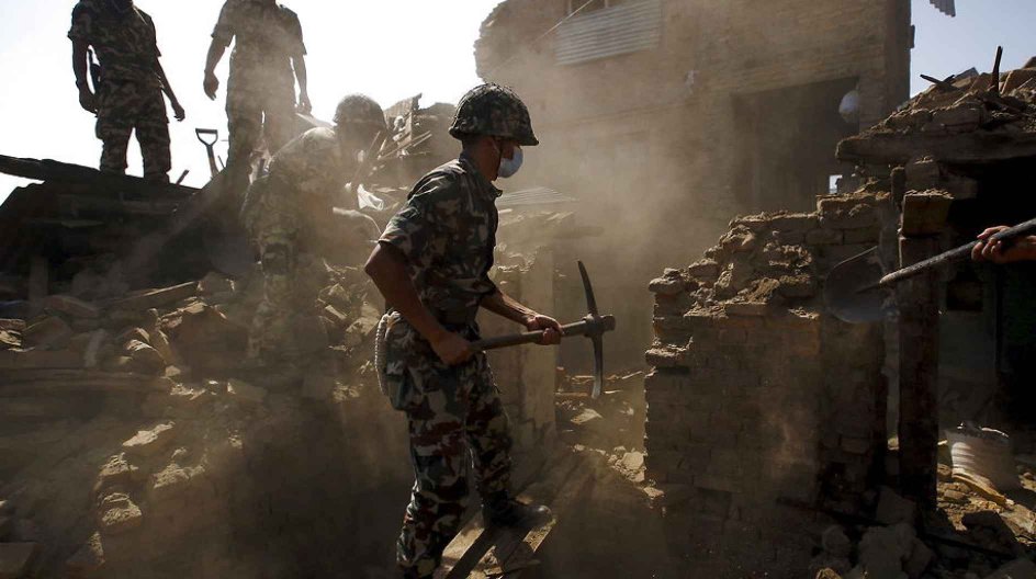 Nepalese army personnel search for victims trapped inside collapsed buildings following Saturday's earthquake in Bhaktapur, Nepal April 27, 2015. REUTERS/Navesh Chitrakar