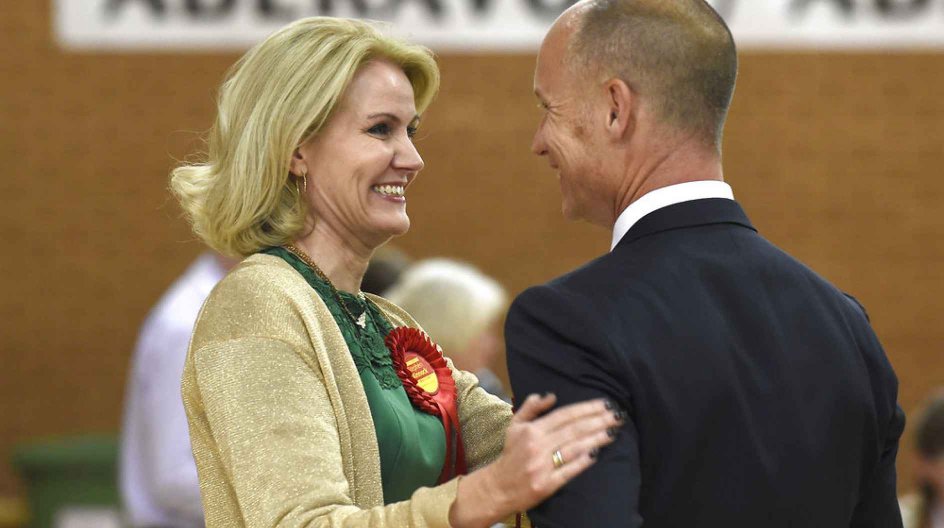 Danish Prime Minister Helle Thorning-Schmidt celebrates with her husband Stephen Kinnock as he is elected the Member of Parliament for the Aberavon Constituency in the Neath Sports Centre, Neath, South Wales, May 8, 2015. REUTERS/Rebecca Naden