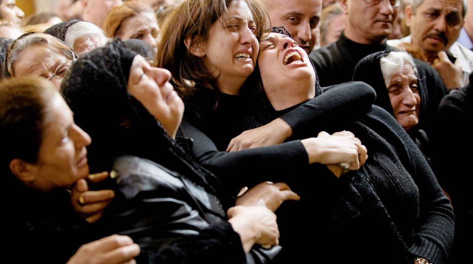 Mourners at Our Lady of Salvation Church during the memorial for those who were killed in a Halloween Day siege at the church in Baghdad, Dec. 10, 2010. A new wave of Iraqi Christians has fled to northern Iraq or abroad amid a campaign of violence and growing fear that the country's security forces are unable or, more ominously, unwilling to protect them. (Shiho Fukada/The New York Times)