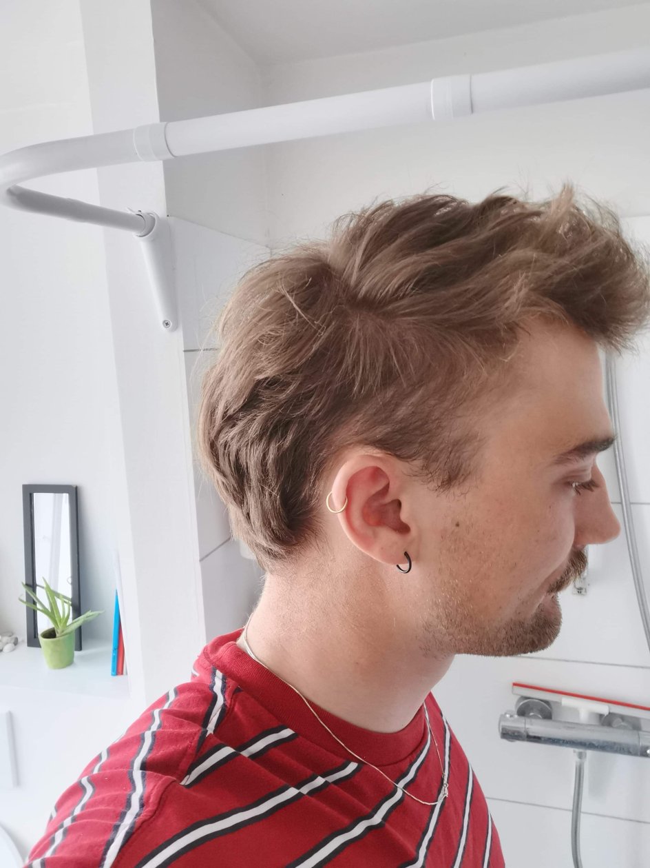 "Jeg synes, mullet er fedt, fordi det er udfordrende. Det har punk-vibrationer over sig. Noget råt og lidt beskidt," siger Louis Skovmand på 26 år fra Aarhus.