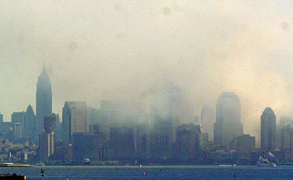 Lower Manhattan and the Statue of Liberty are seen from Staten Island 12 September 2001 as smoke continues to rise from the rubble of the World Trade Center towers. The buildings collapsed 11 September following a terrorist attack. AFP PHOTO Doug KANTER