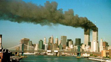 Smoke is seen at the towers of the World Trade Center shortly after being struck by a hijacked commercial aircraft, in New York, U.S., September 11, 2001. REUTERS/Brad Rickerby